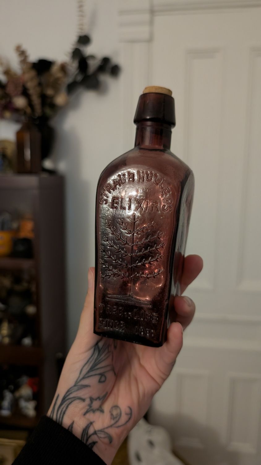 Purple elixir of life glass bottle