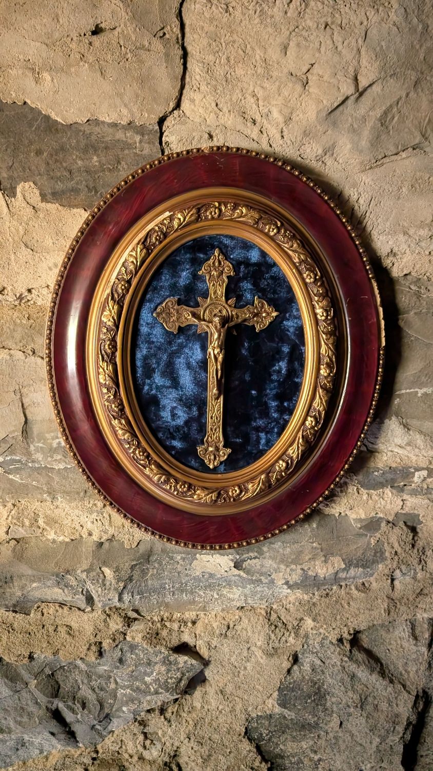 Framed crucifix on blue velvet frame