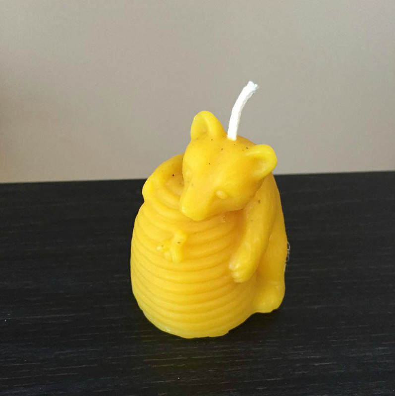 Bear hugging bee hive candle