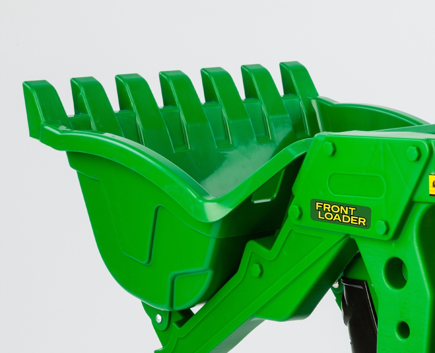 Tractor agri­cola a pedal con pala cargadora