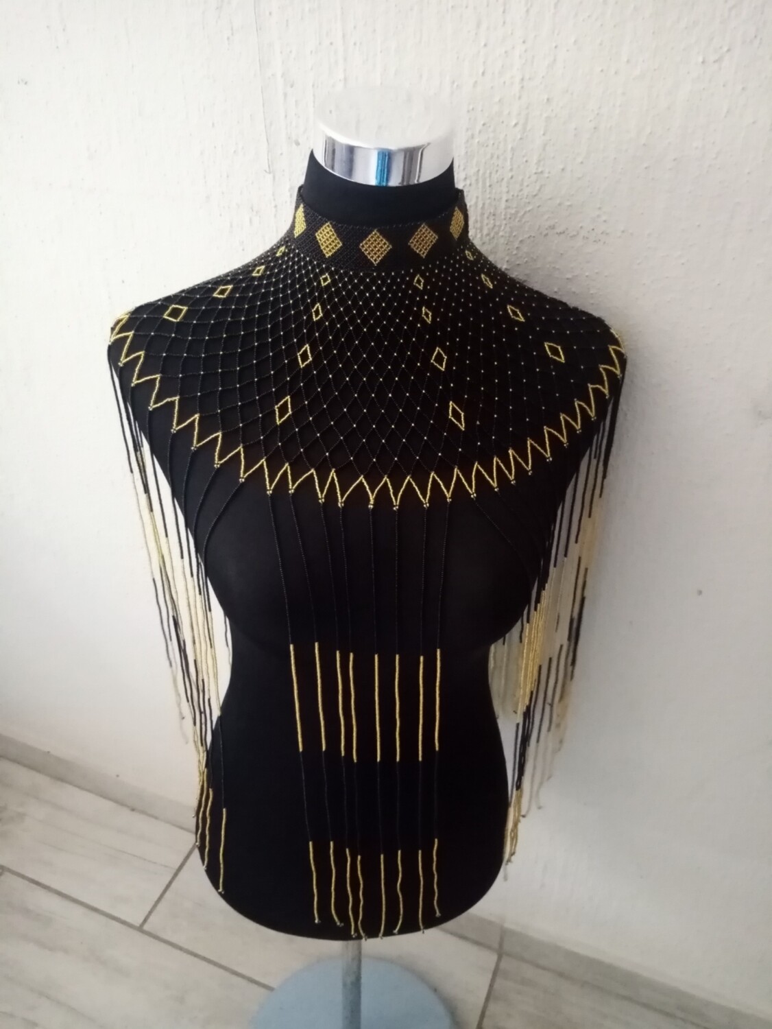Black and gold beaded neck piece with tassels