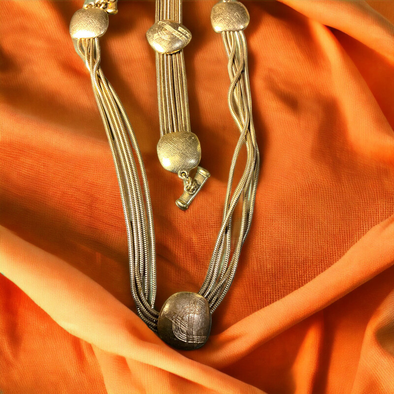 Yves Saint Laurent vintage necklace and bracelet set all in brass with logo