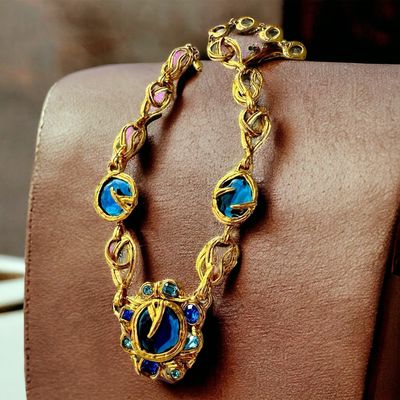 Collier Yves Saint Laurent Vintage en Métal Doré et Cabochons Bleu Azur - Design Sculptural et Audacieux Nom du produit