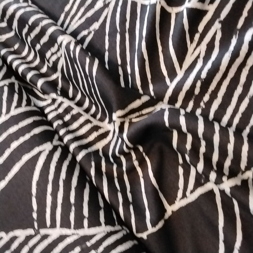 Stoff schwarz gemustert