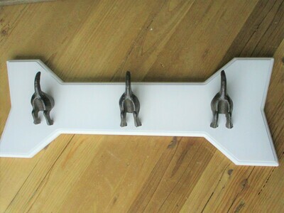 3 DOG TAIL COAT HOOKS ON WHITE BACKING 3 DOG TAIL COAT HOOKS ON WHITE BACKING