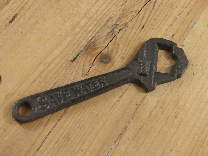 CAST IRON CAST IRON "SAVE WATER" WRENCH BOTTLE OPENER