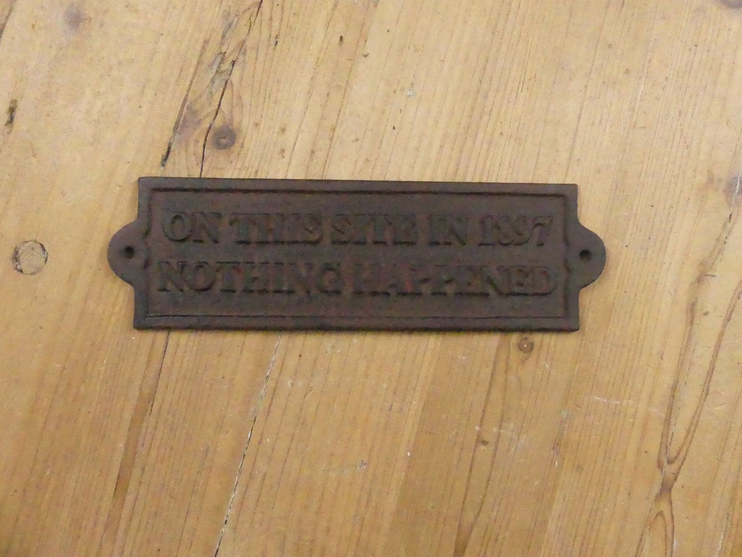 "ON THIS SITE IN 1897 NOTHING HAPPENED" CAST IRON SIGN