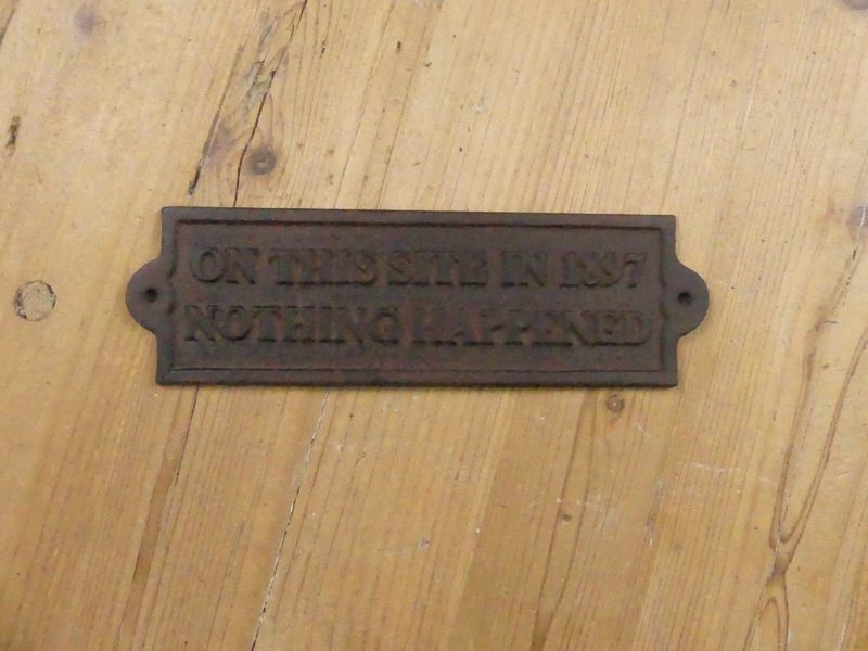 "ON THIS SITE IN 1897 NOTHING HAPPENED" CAST IRON SIGN