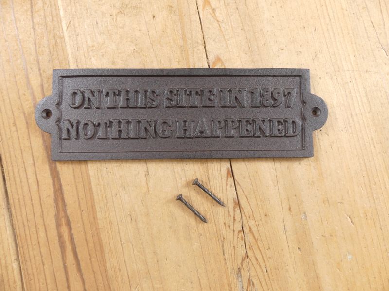 "ON THIS SITE IN 1897 NOTHING HAPPENED" CAST IRON SIGN