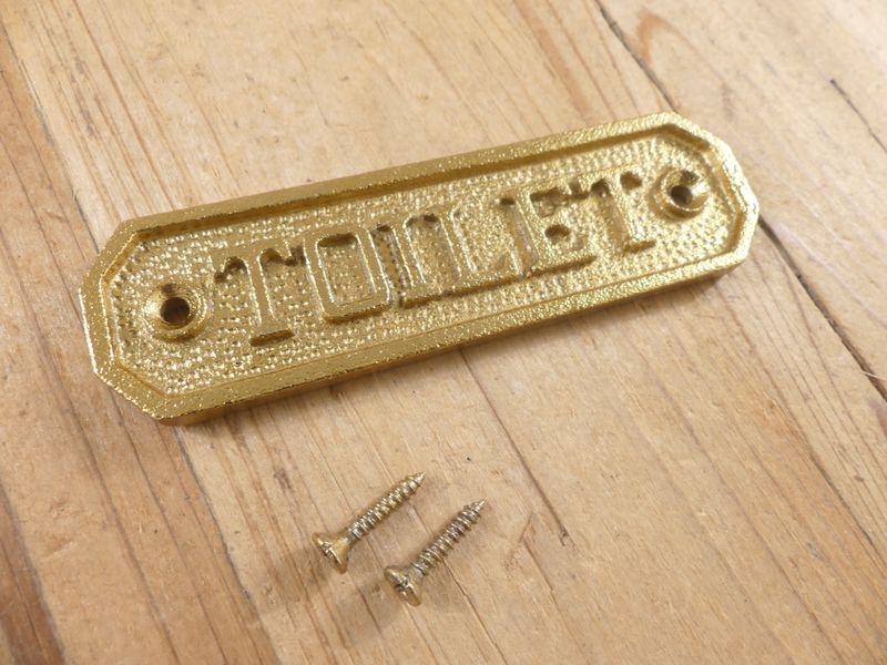 SMALL GOLD "TOILET" SIGN,  4 1/2"  LONG " X 1 1/4" WIDE