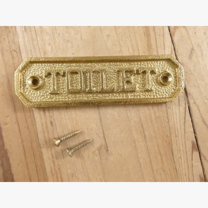 SMALL GOLD "TOILET" SIGN,  4 1/2"  LONG " X 1 1/4" WIDE
