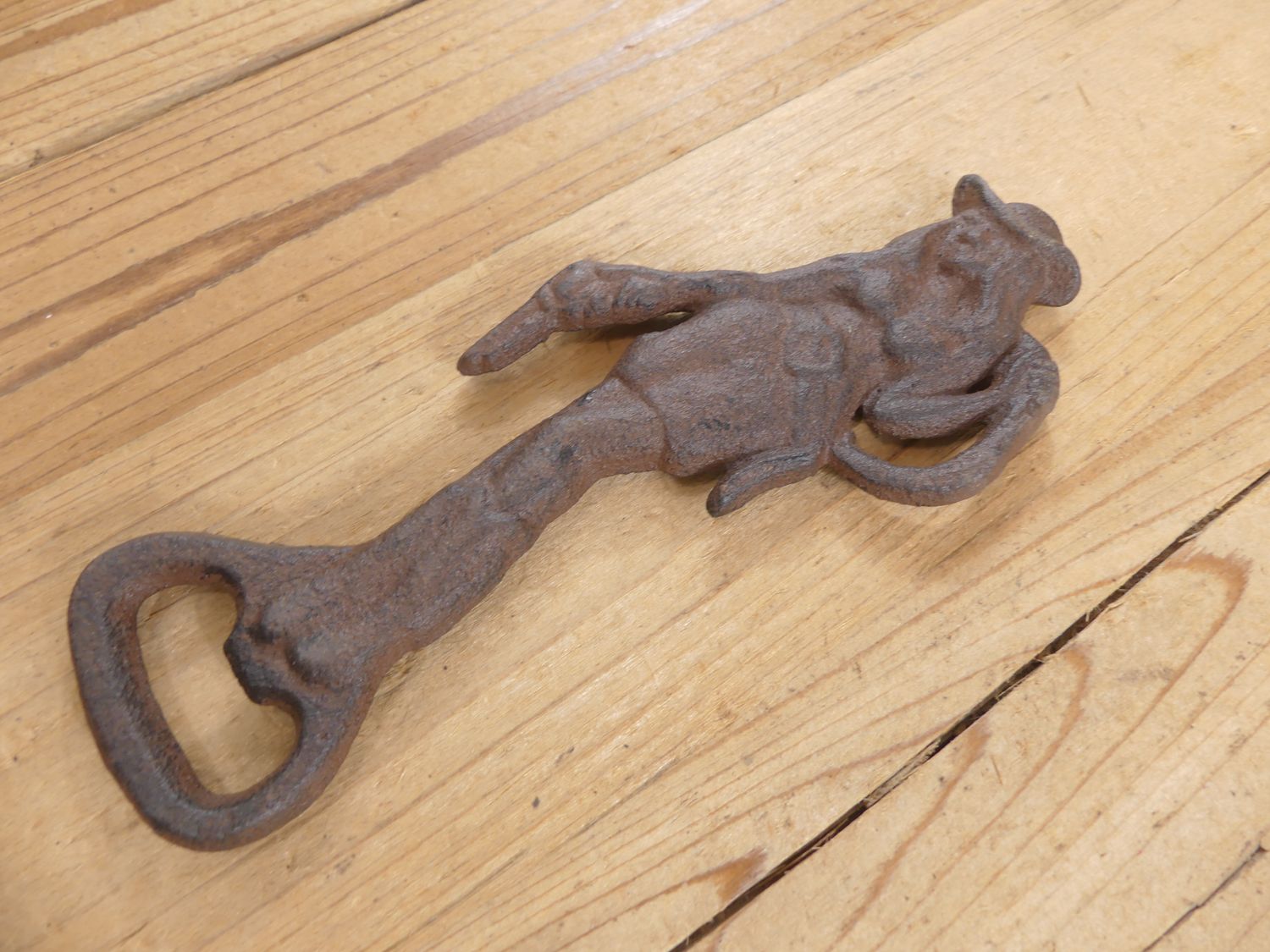 CAST IRON COWGIRL HAND HELD BOTTLE OPENER CAST IRON COWGIRL HAND HELD BOTTLE OPENER