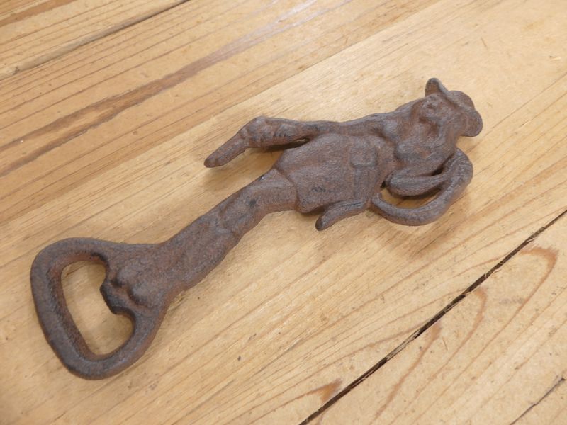 CAST IRON COWGIRL HAND HELD BOTTLE OPENER