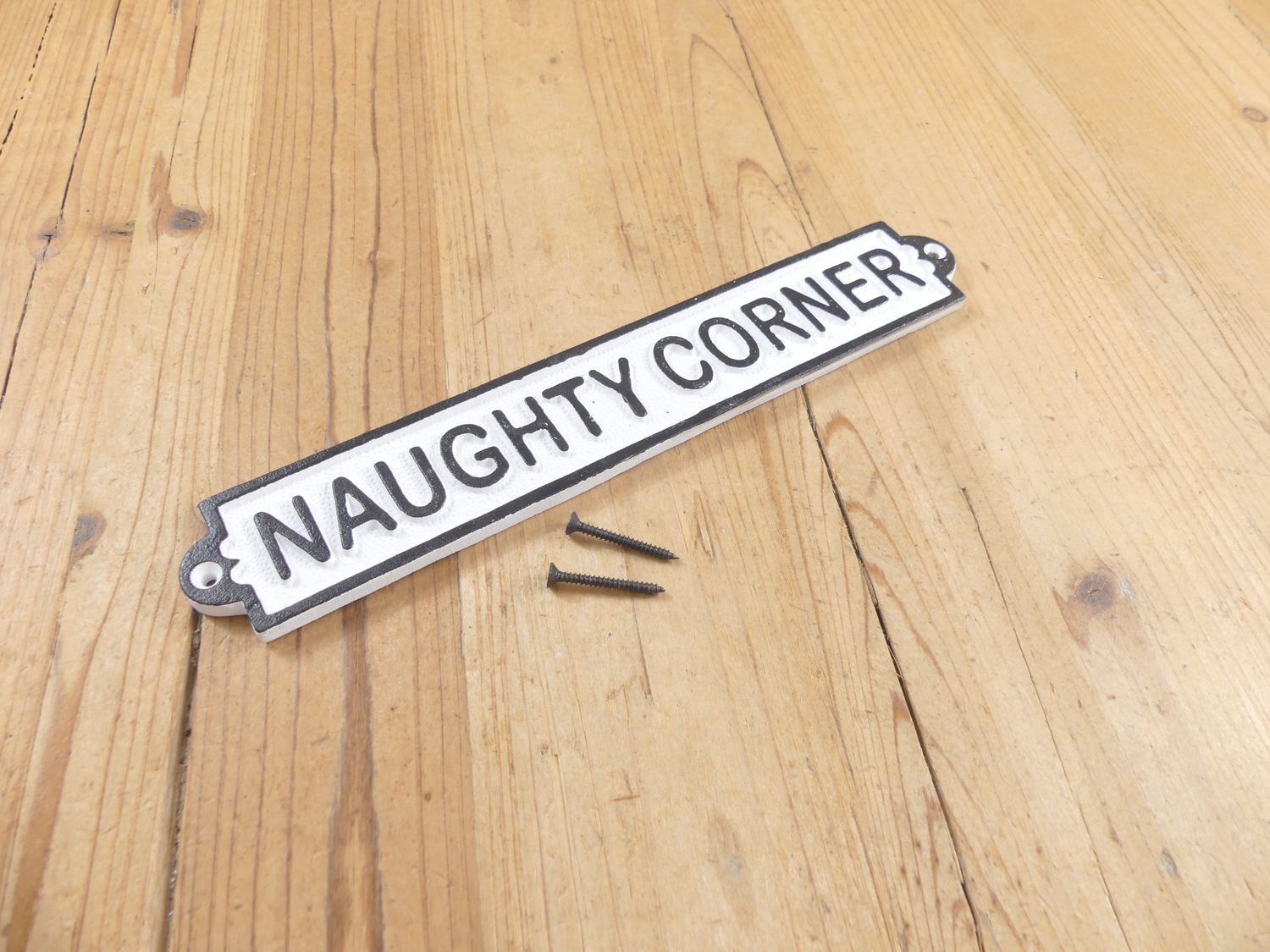 CAST IRON "NAUGHTY CORNER" SIGN