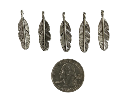 silver metal feather charm with quarter