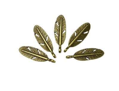 bronze metal feather charm close up