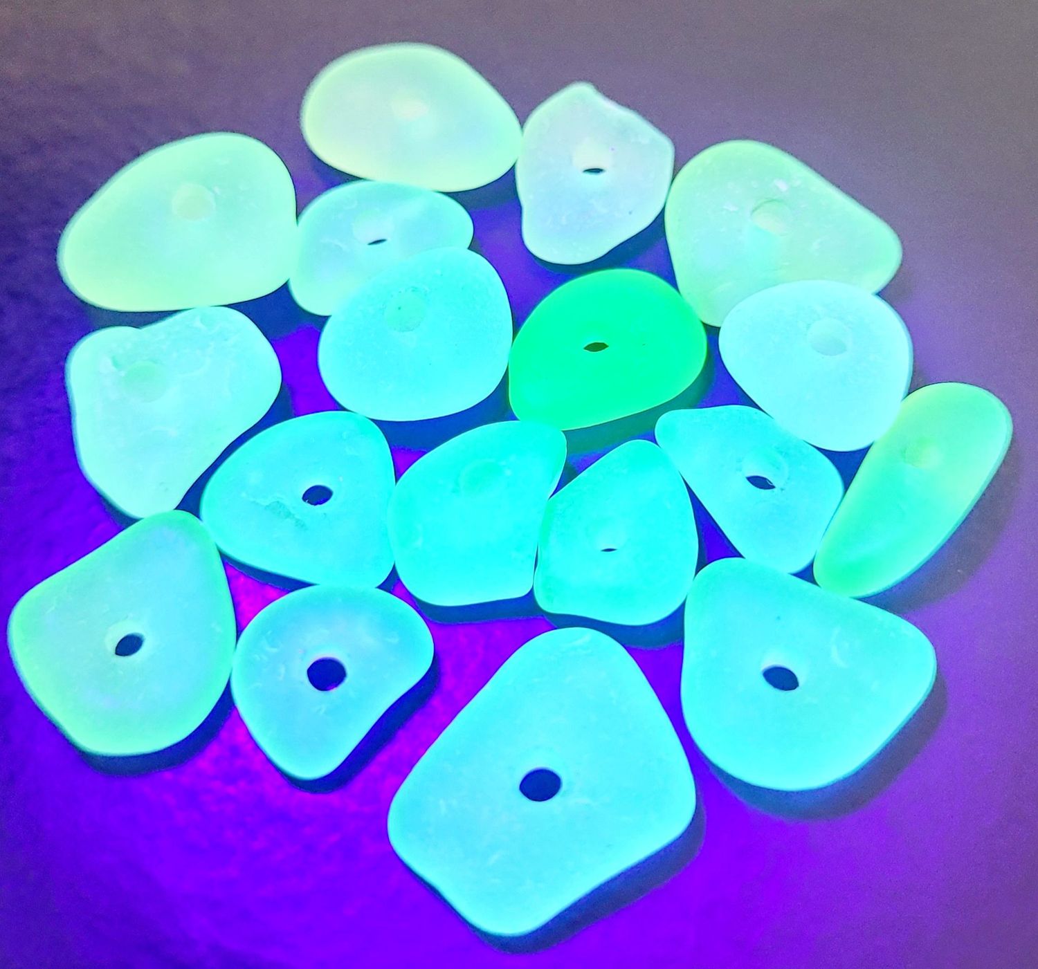 Glowing Drilled UV Lime - 18pcs