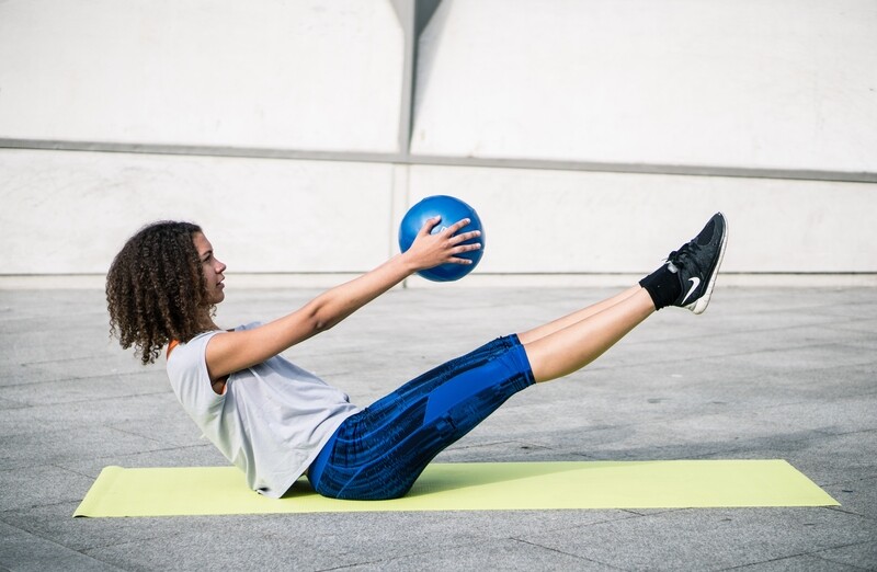Urban Fitness Pilate Ball
Blue Finish
Person working out with ball on mat