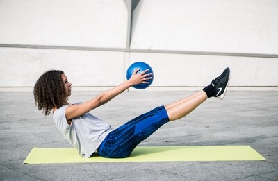 Urban Fitness Pilate Ball
Blue Finish
Person working out with ball on mat