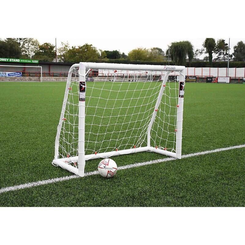 Precision Match Goal Posts
White finish on a pitch
Football in goal