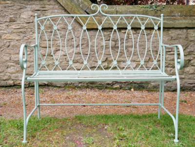 It is a metal bench and looks very smart with a pistachio green finish.