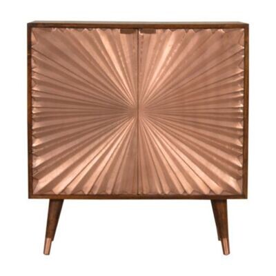 An attractive copper fronted cupboard having a sunray-type design