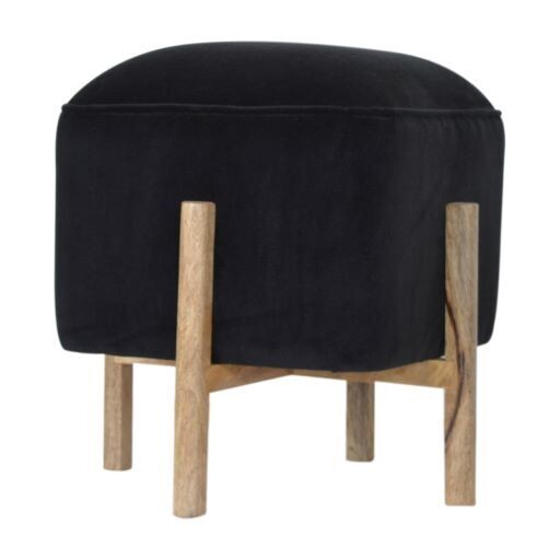 A fashionable black velvet footstool in a solid wood stand making it a fine piece of furniture. 