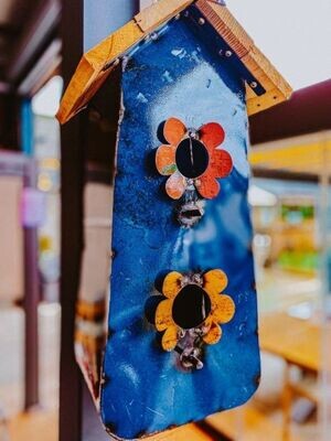 Just see the artistic work that has gone into the making of this bird house.