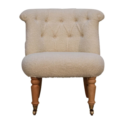 Well, doesn't this lovely accent chair look so comfortable, and of course it's so practical too. With the buttoned cream boucle fabric and the solid oak effect legs, it makes for a good looking combination.