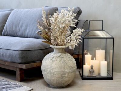 Cara Pot
Antique Cream Finish Bulbous shape with funnel neck
Sited next to the serene sofa and lantern with candles, dressed with dried flowers