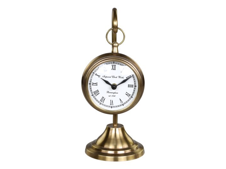 A lovely timepiece- a clock suspended on a brass stand.