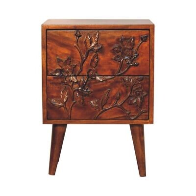 An intricate pretty leafy design on the drawers 