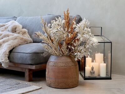 Parvati Vase
Natural Finish with decorative rim pattern design
Wide neck
Sited next to the serene sofa and lantern filled with candles.  Dressed with dried flowers