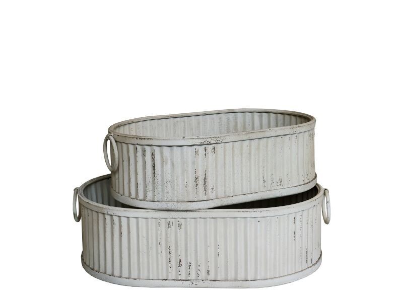 Set of two oblong grooved planters with handles.
Finish is Antique Cream