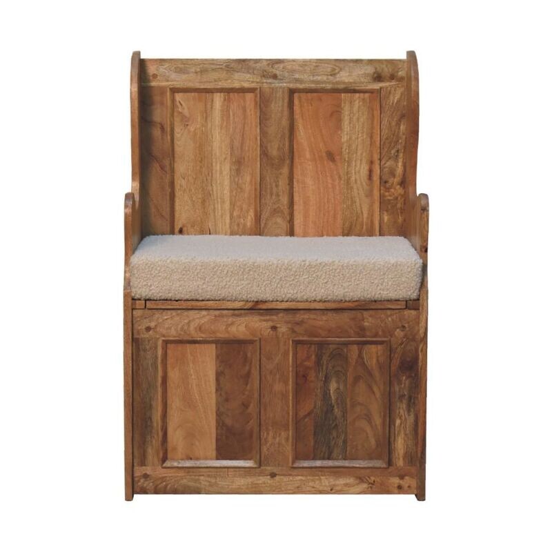 This mini Monks Bench is made from solid Mango wood and finished in an oak effect shade. It has been hand crafted, and finished with a cream boucle seat pad. It is a bit smaller than a usual monks bench, making it useful for those places where a larger unit just won't fit! Here we have a front view.