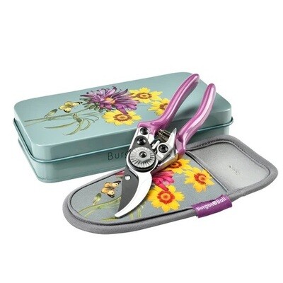 Burgon & Ball Asteraceae Pruner and Holster Set Asteraceae Design. Light Duck Egg Blue with three yellow flowers and one purple flower design.
Purpled handled pruner and holster featuring pattern and trimmed in grey. Gift box with pattern featured on lid.