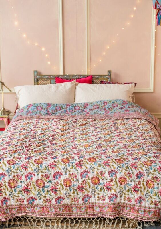 The right size for a standard double bed, this floral patterned quilt is made from 100% recycled materials, and made in India.