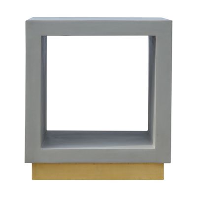 A contemporary bedside cabinet without any fiddly drawers- just an open space to store larger items. It is crafted with solid mango wood with a cement finish and a gold base. 
