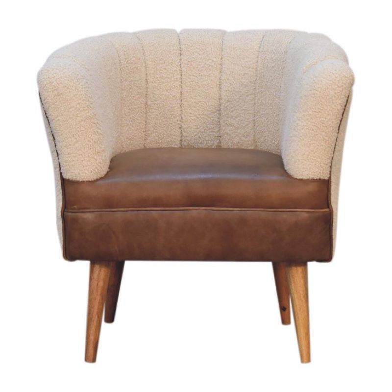 Quality and style combine to make our cotton boucle and tan leather chair so luxurious. 