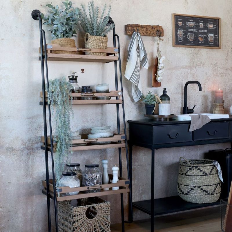 Each shelf has sides to prevent items toppling off.