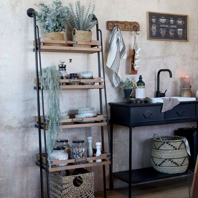 Each shelf has sides to prevent items toppling off.