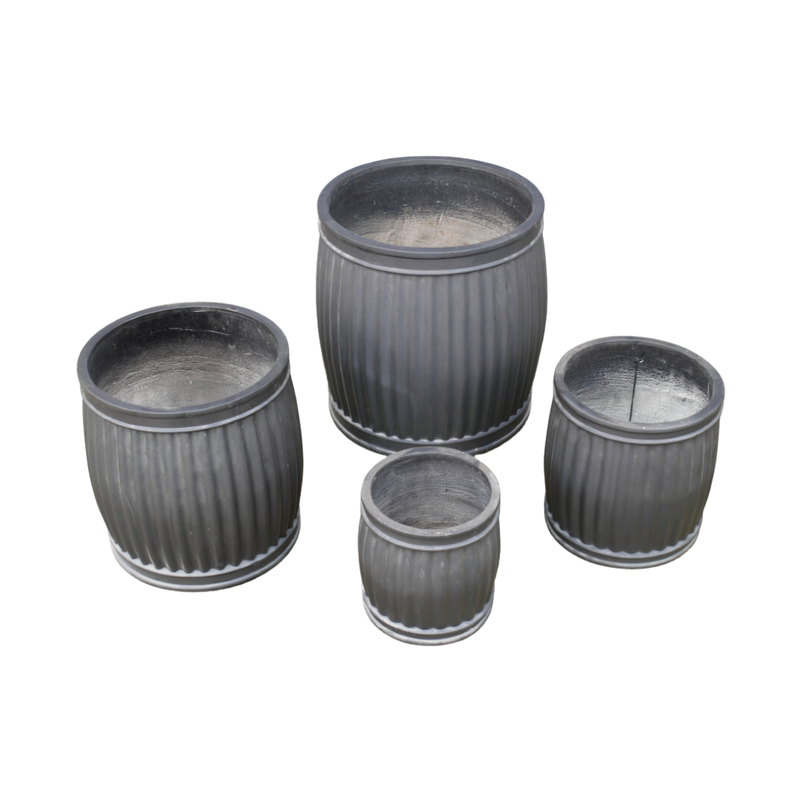 A set of four Feldspar Clay barrel-shaped planters