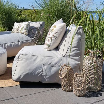 Soft Cushion Chair Finished in Beige set outside with soft Cushion bed and lanterns