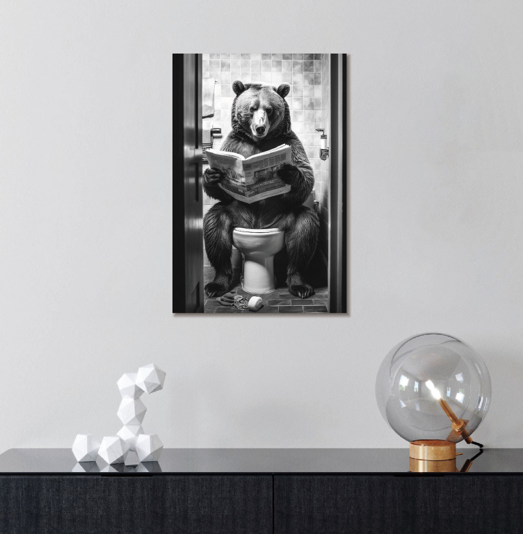 Bear sat on toilet reading a newspaper in a black and white finish
Image of picture on a wall in a home