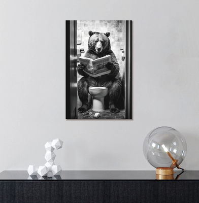 Bear sat on toilet reading a newspaper in a black and white finish
Image of picture on a wall in a home