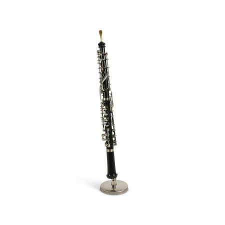 A beautifully crafted clarinet ornament on a stand.