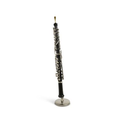 A beautifully crafted clarinet ornament on a stand.
