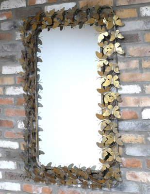 Beautiful rectangular mirror in lovely golden frame of butterflies with wings out.
Made of metal and very attractive.
Height 115 cm and width of 80 cm.
Shown against indoor brick wall