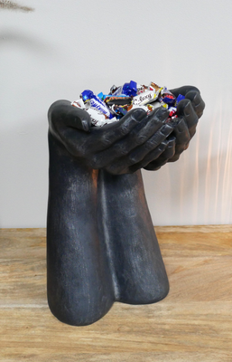 Pair of arms and hands asking for more!
Made from resin and will look good on any shelf or surface.Height 38 cm
Shown on wooden shelf with pot pourri handful.