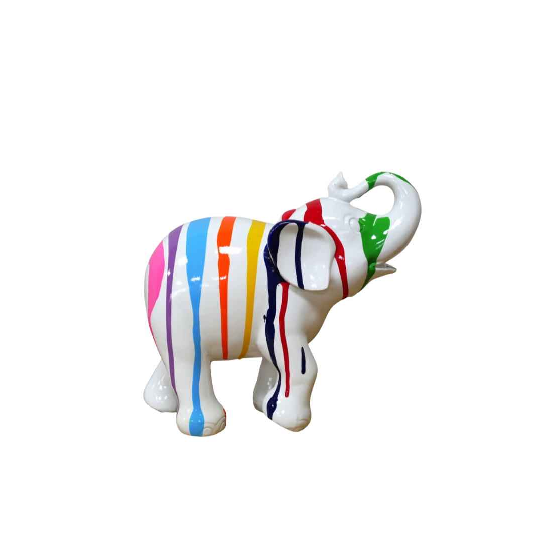 Side view on a shelf of this magnificent elephant is sculpted from clear white resin with rainbow colours of paint dripping down his entire body! A standing trumpeting stance. Height 18 cm